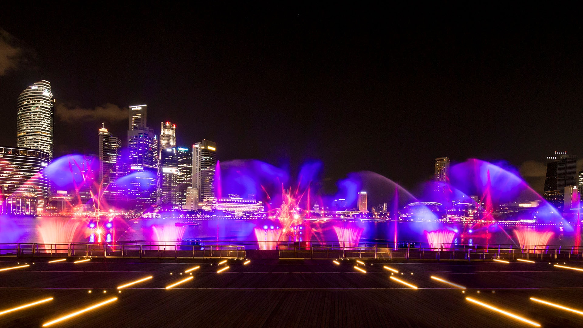A daily free light and water show, right in front of Marina Bay Sands