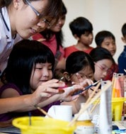 School kids painting in ArtScience Museum