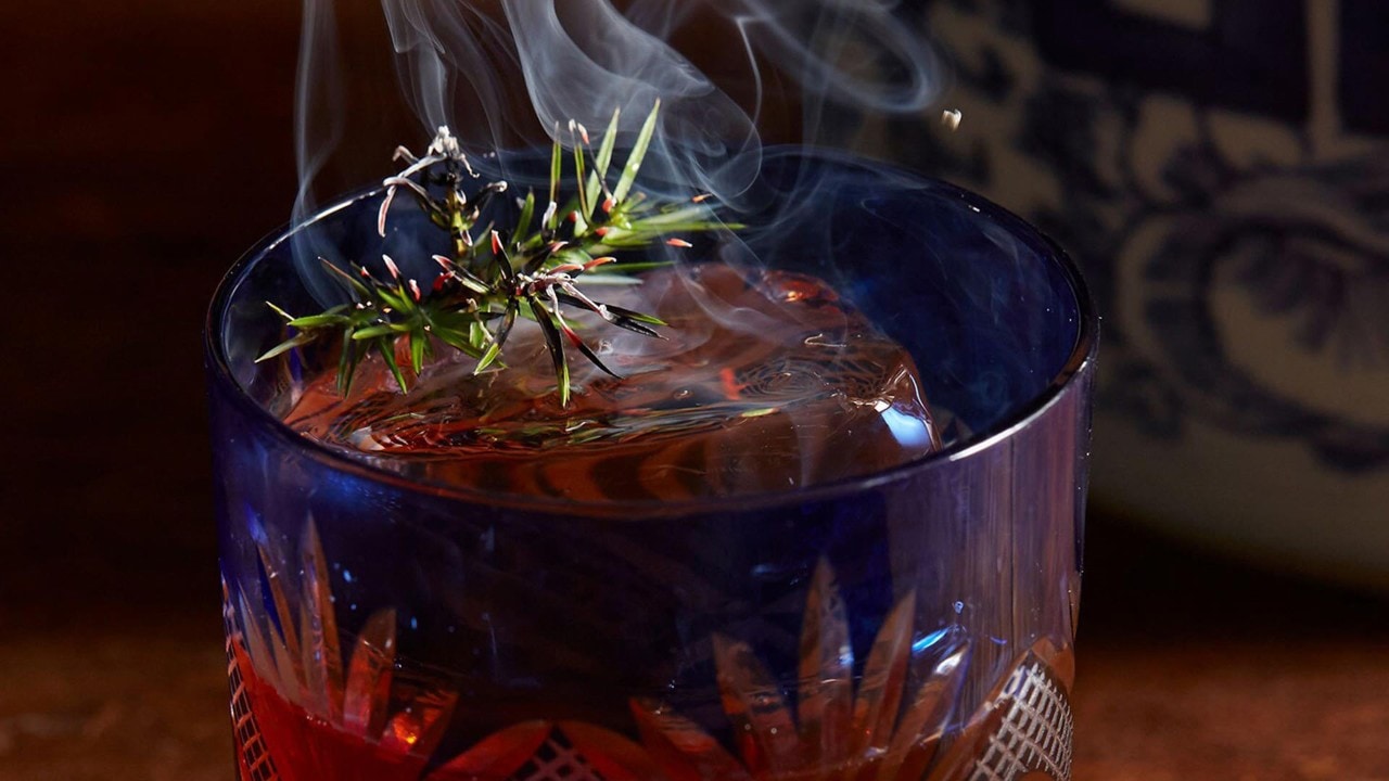 Cocktail with smoke at Mott 32 Singapore, one of the top bars in Singapore