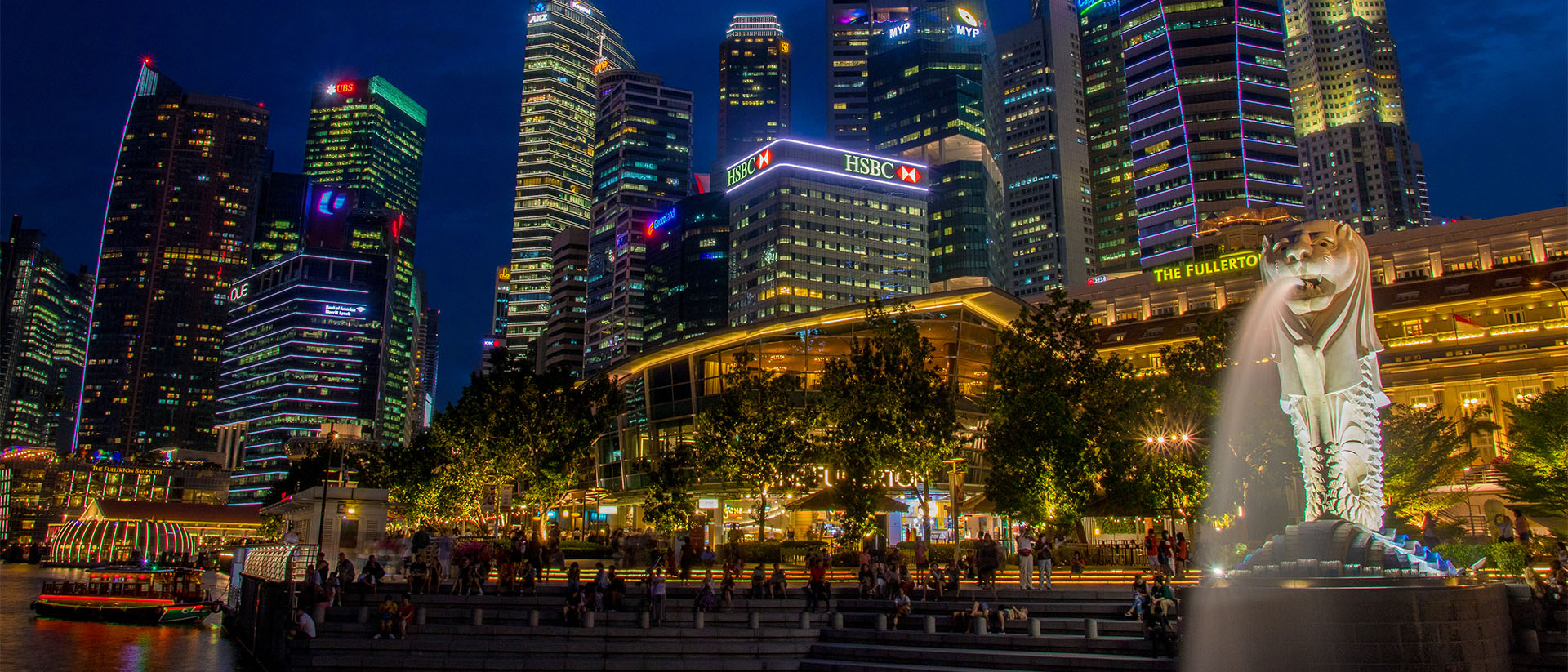 Night view of Marina Bay, Singapore with the iconic Merlion