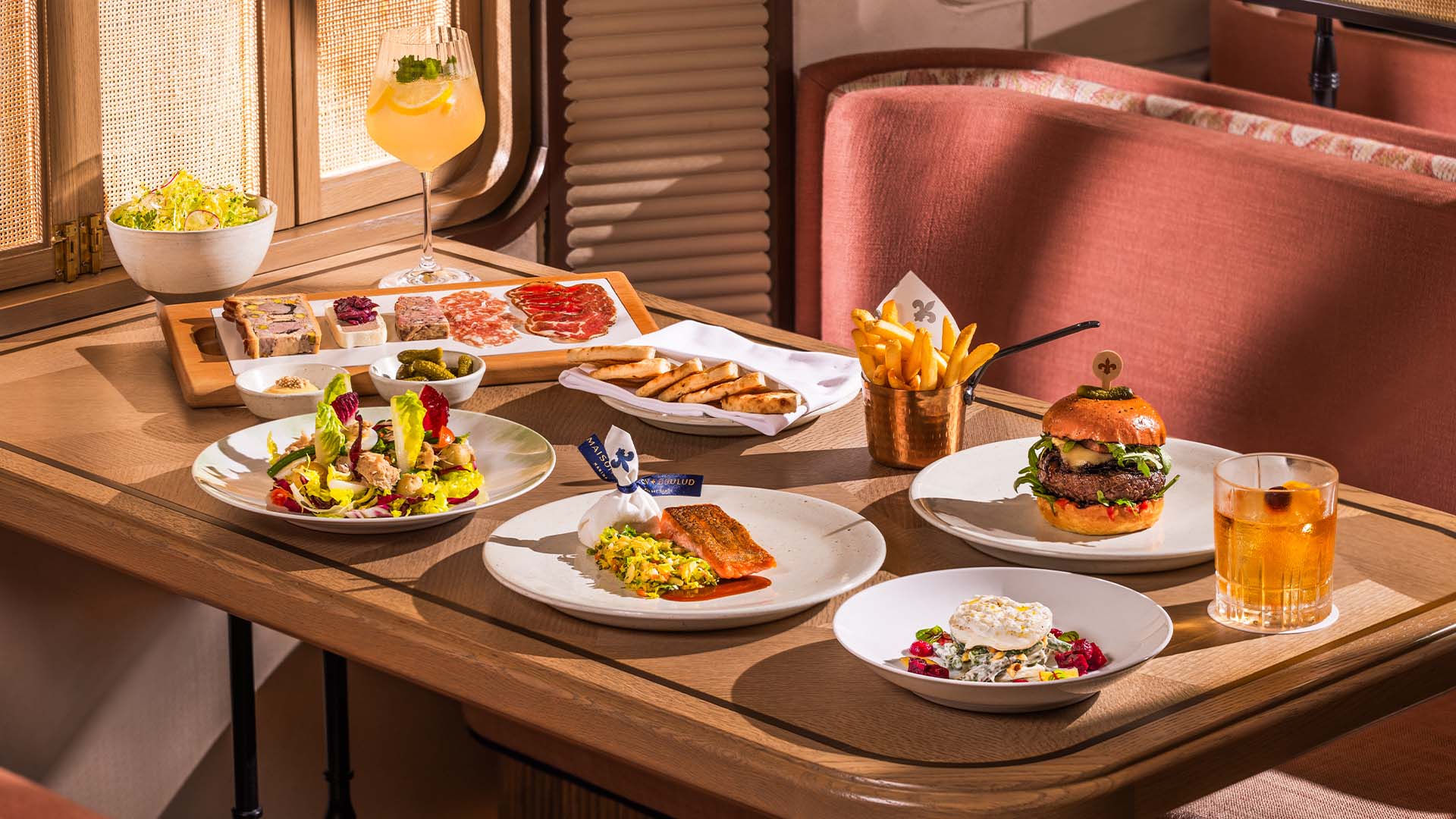 A feast featuring French classics at Maison Boulud, a restaurant for pre-show dining