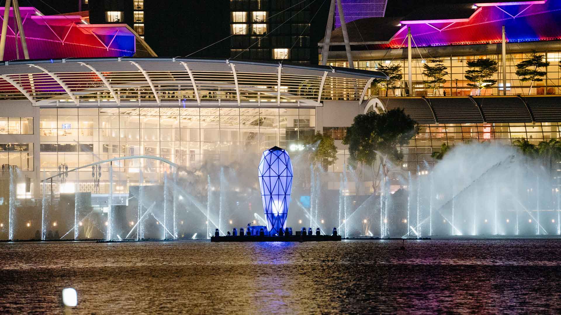 View of the blue and purple light and water show from the Event Plaza, Marina Bay Sands during The Eras Tour