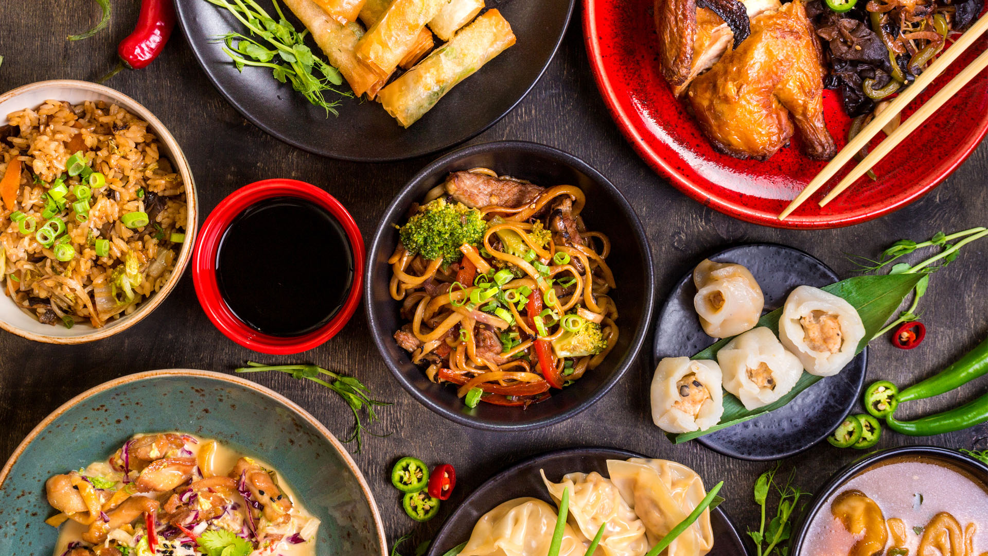 Assorted asian food with noodles, dumplings and rice