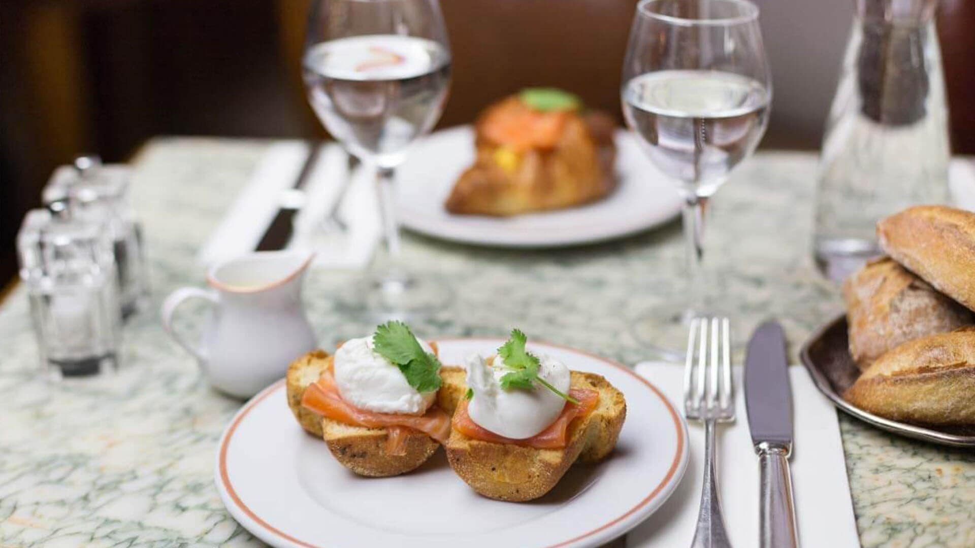 Eggs with smoked salmon on toast, served with tea for high tea in Singapore at Angelina