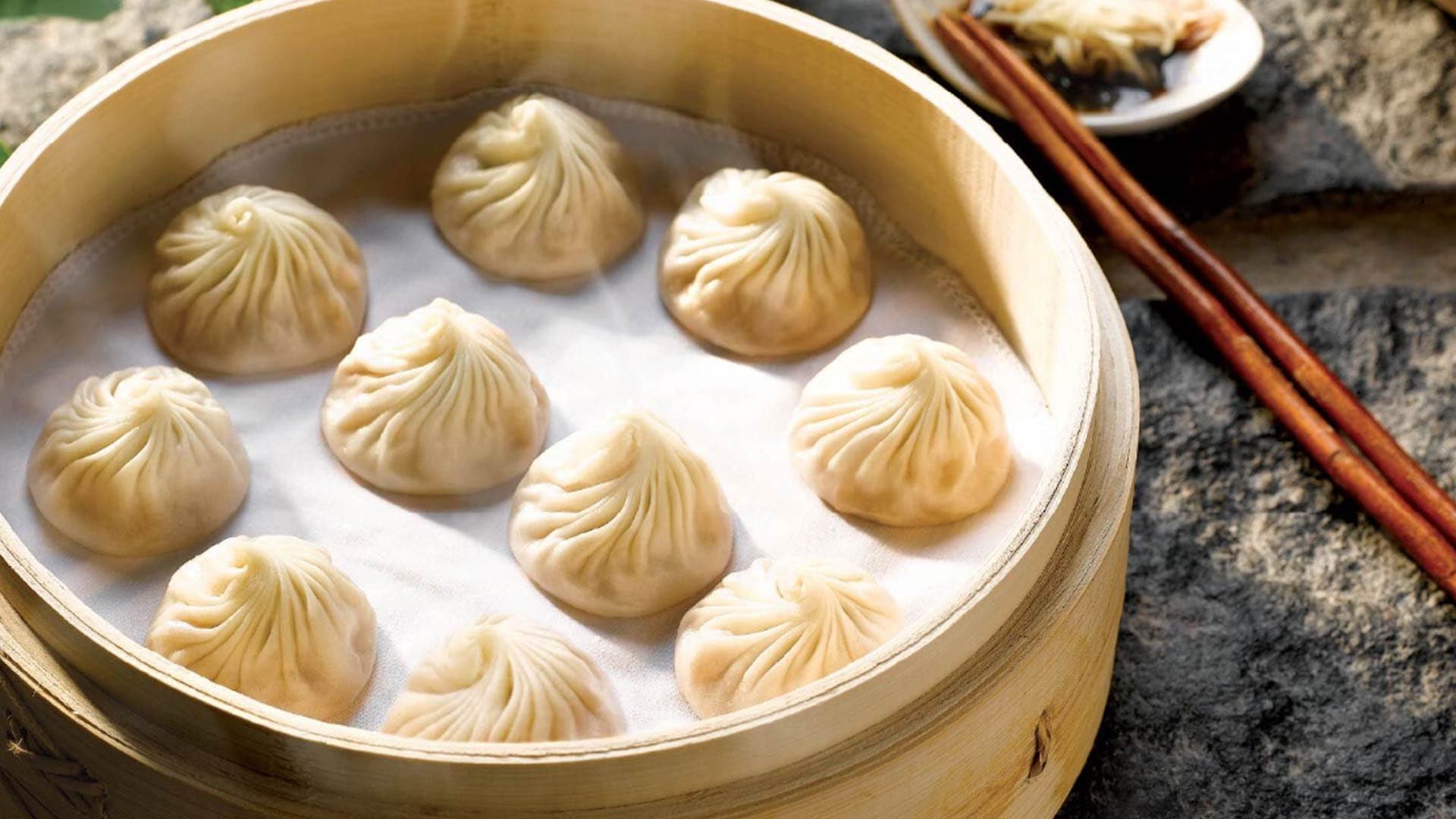 Basket of steamed pork dumplings, xiao long baos