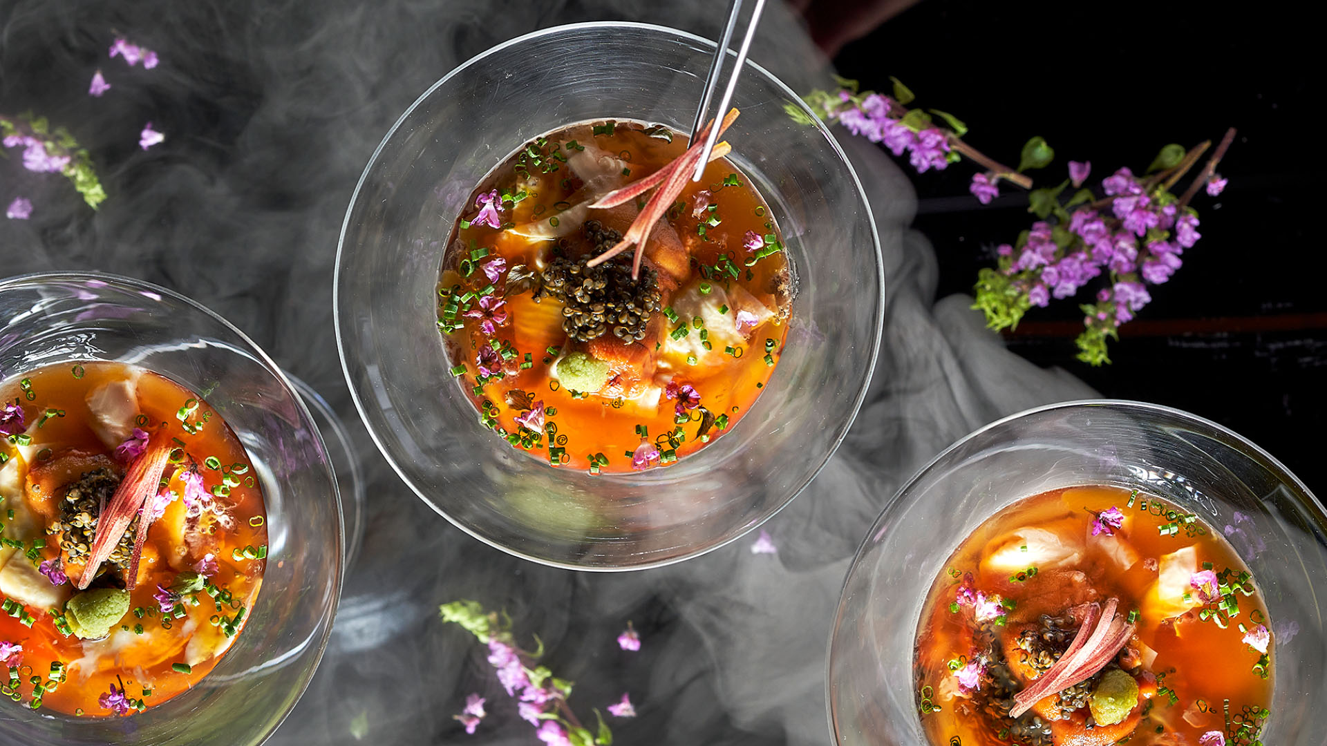 Salmon nigiri sushi getting torched at a restaurant recommended in the 2025 Michelin Guide