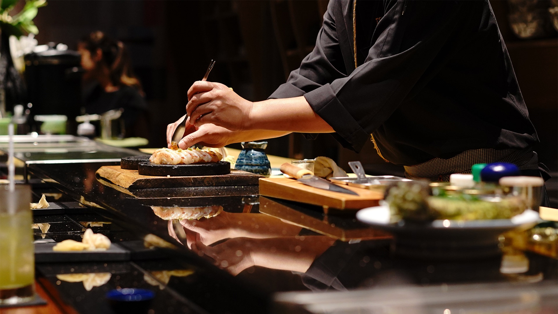 Chef making a sushi for omakase dining in Singapore