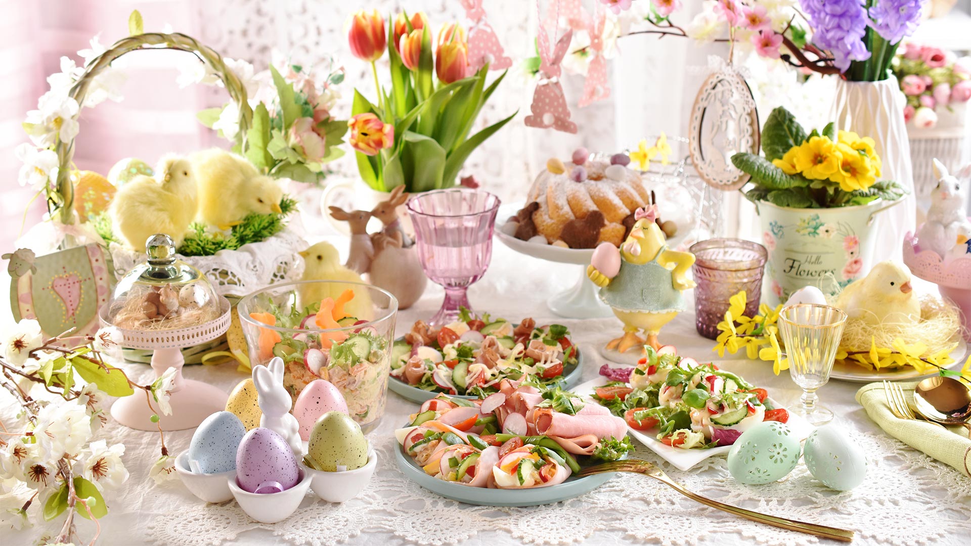 Dining table filled with Easter delights and goodies to celebrate Easter 2024