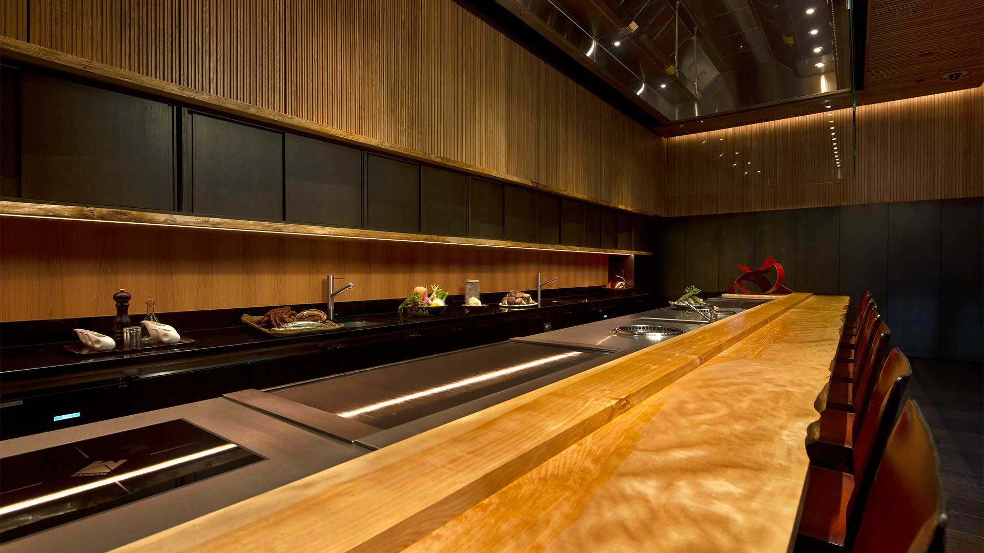 Dining at the Chef's Table of Waku Ghin, a restaurant with private rooms to hold private events