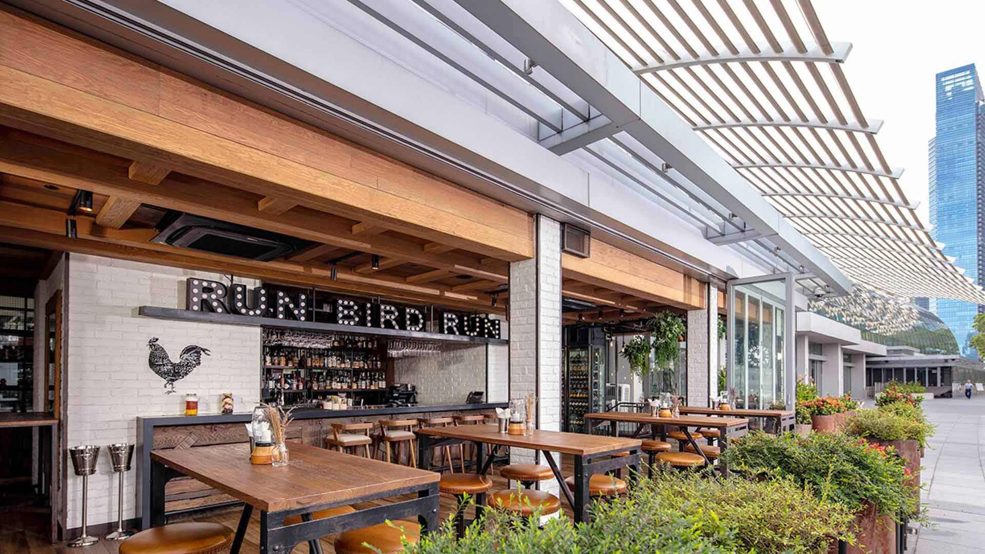 Alfresco dining area at Yardbird, an outdoor setting for private dining and events in Singapore