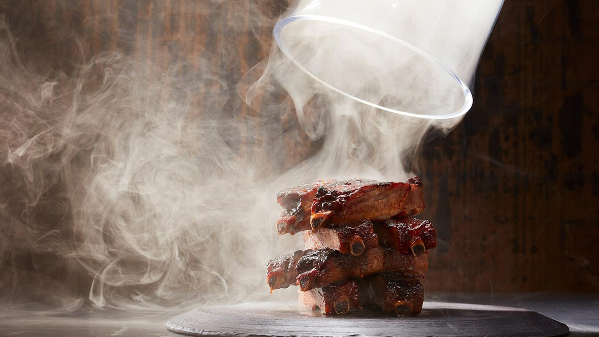 Smoked pork ribs served at Yardbird, a restaurant with private dining enquiries