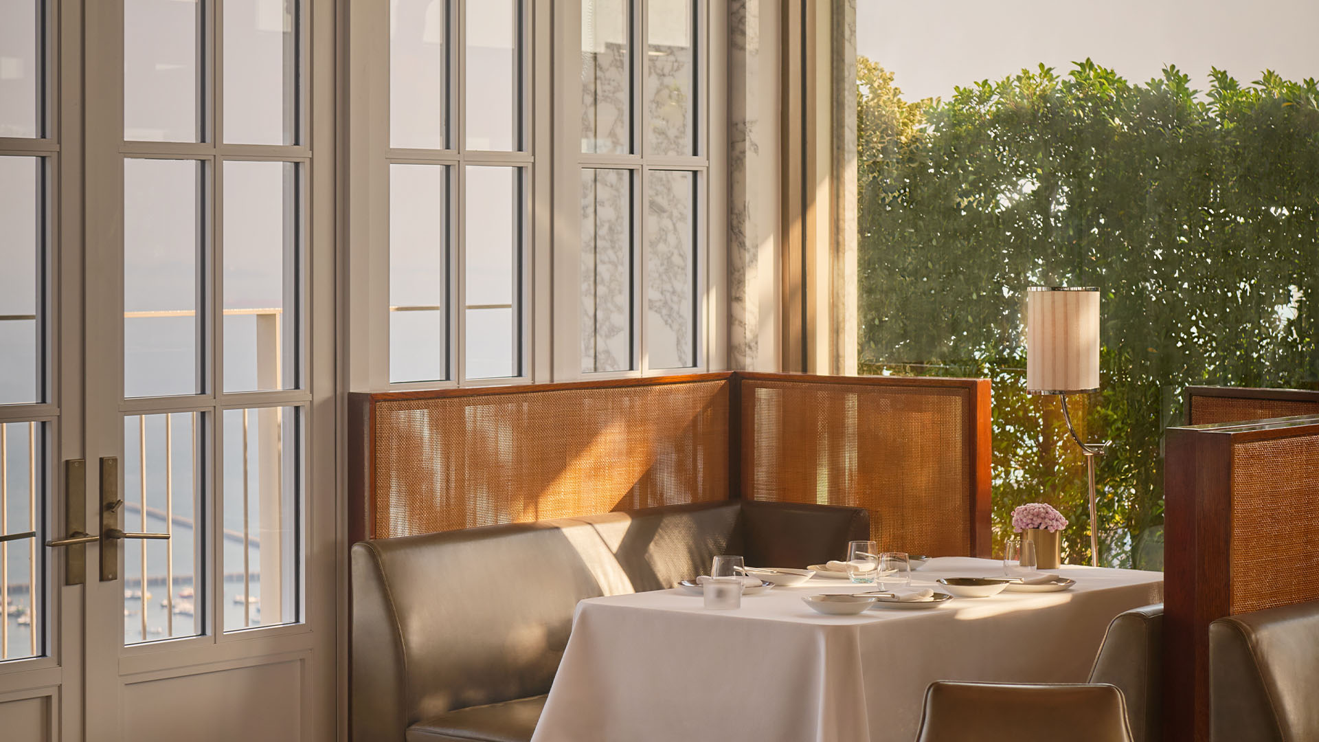 Dining area at Spago, a rooftop restaurant, overlooking the harbour from 57th storeys above