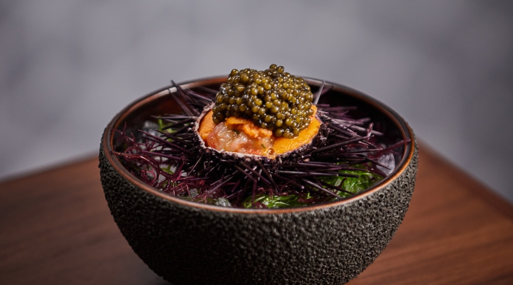 An exquisite dish featuring fresh botan shrimp with sea urchin and caviar at Waku Ghin Singapore