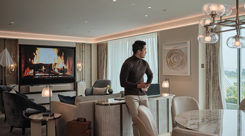 Man in a luxury suite at Marina Bay Sands for a Father's Day staycation in Singapore