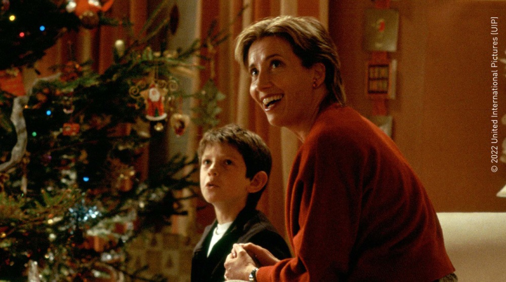 Mother and son smiling and celebrating Christmas