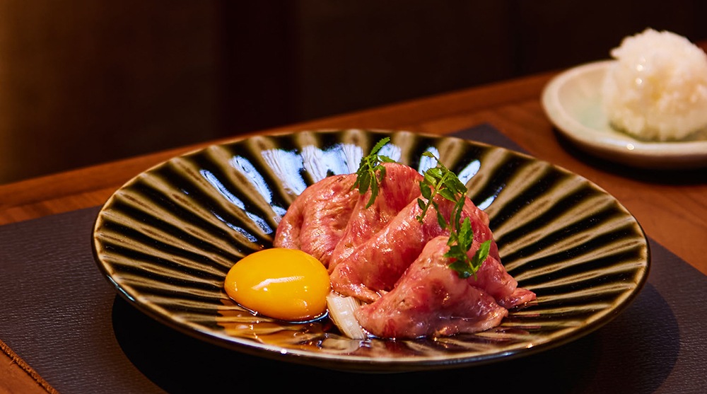 A5 wagyu beef with raw egg yolk, a Japanese sukiyaki dish
