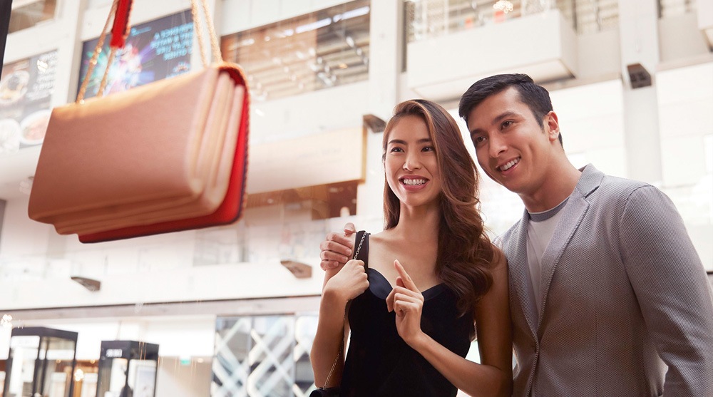 Couples looking at a luxury bag at The Shoppes, Marina Bay Sands