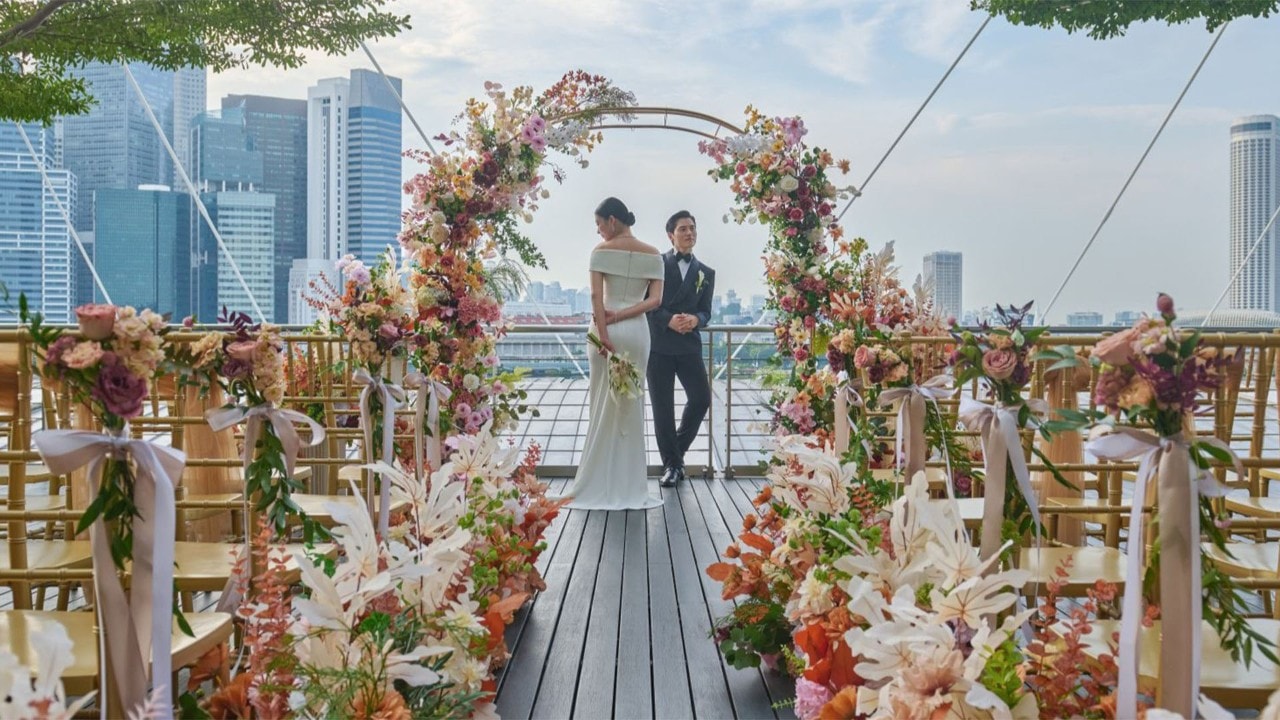 Couple planning and holding their wedding ceremony at Marina Bay Sands, Singapore