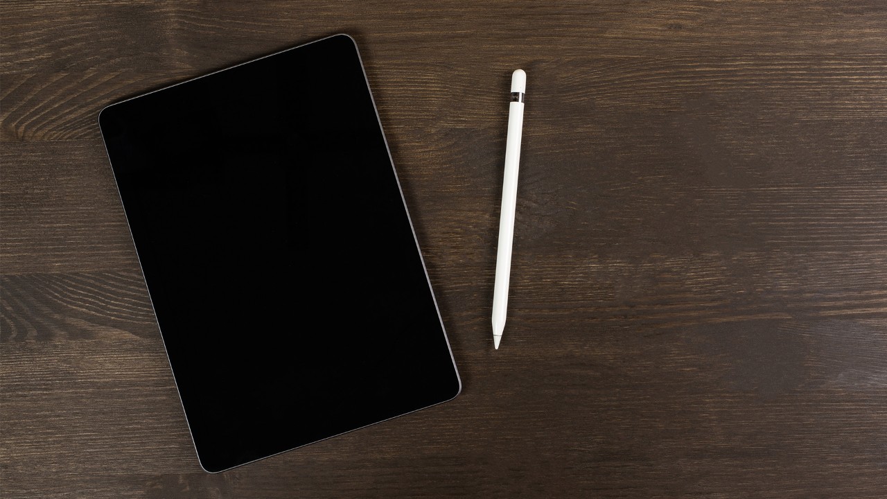 Front view of iPad Air, a tech gift idea, with five more fanned behind it in different colours