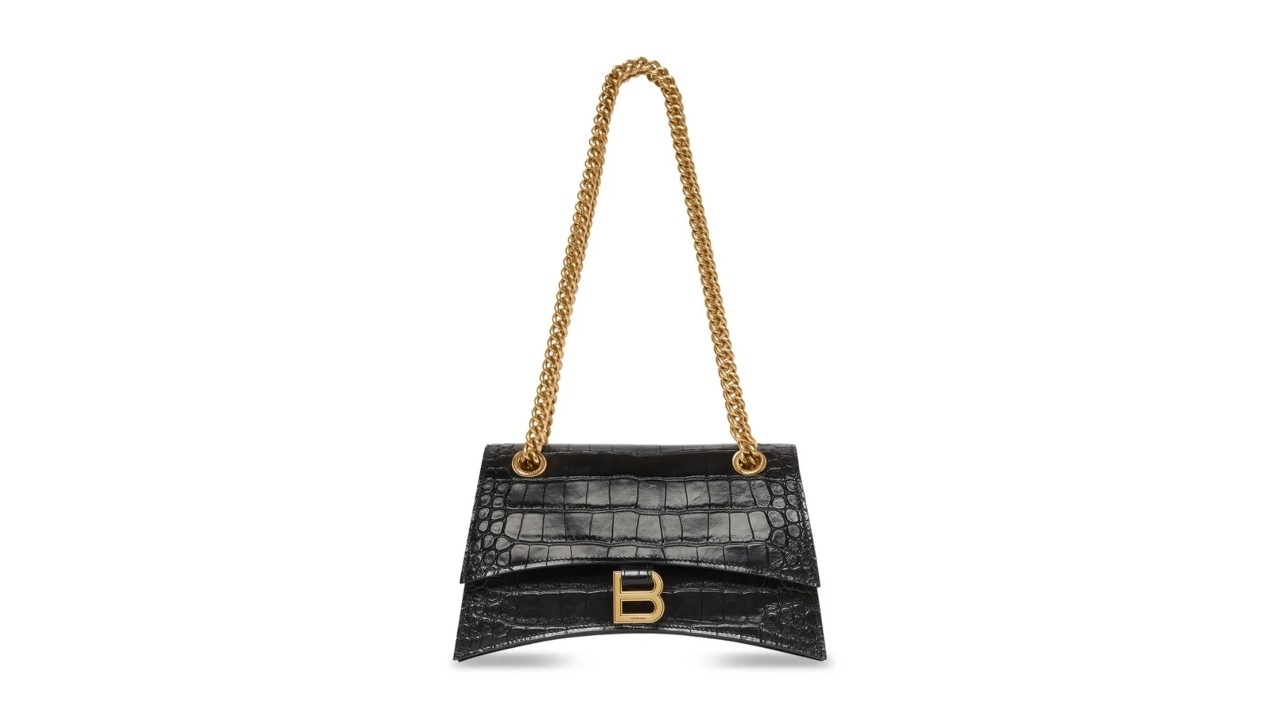 A luxury chained black bag with a B logo