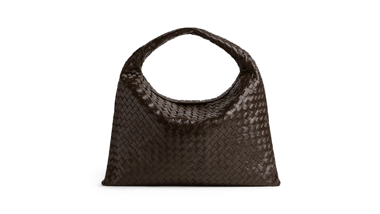 Brown shoulder bag with interwoven patterns from a luxury bag brand, Bottega Veneta