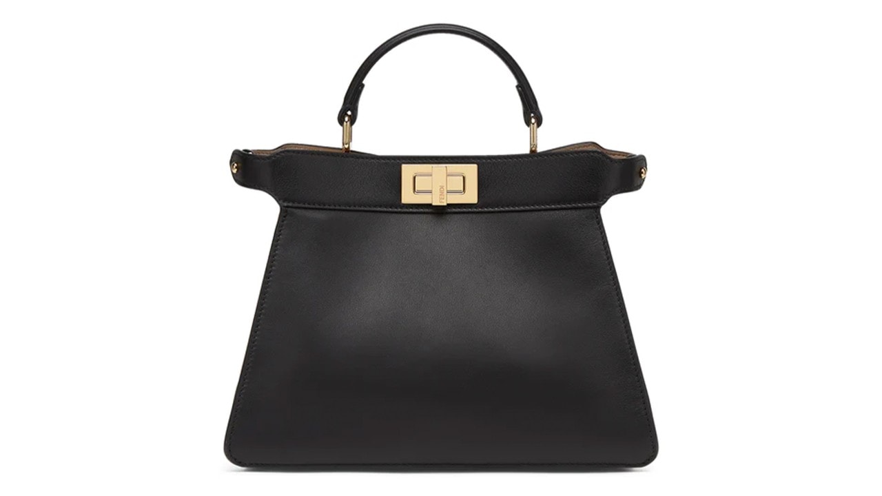A quiet luxury bag in black with a gold buckle from FENDI