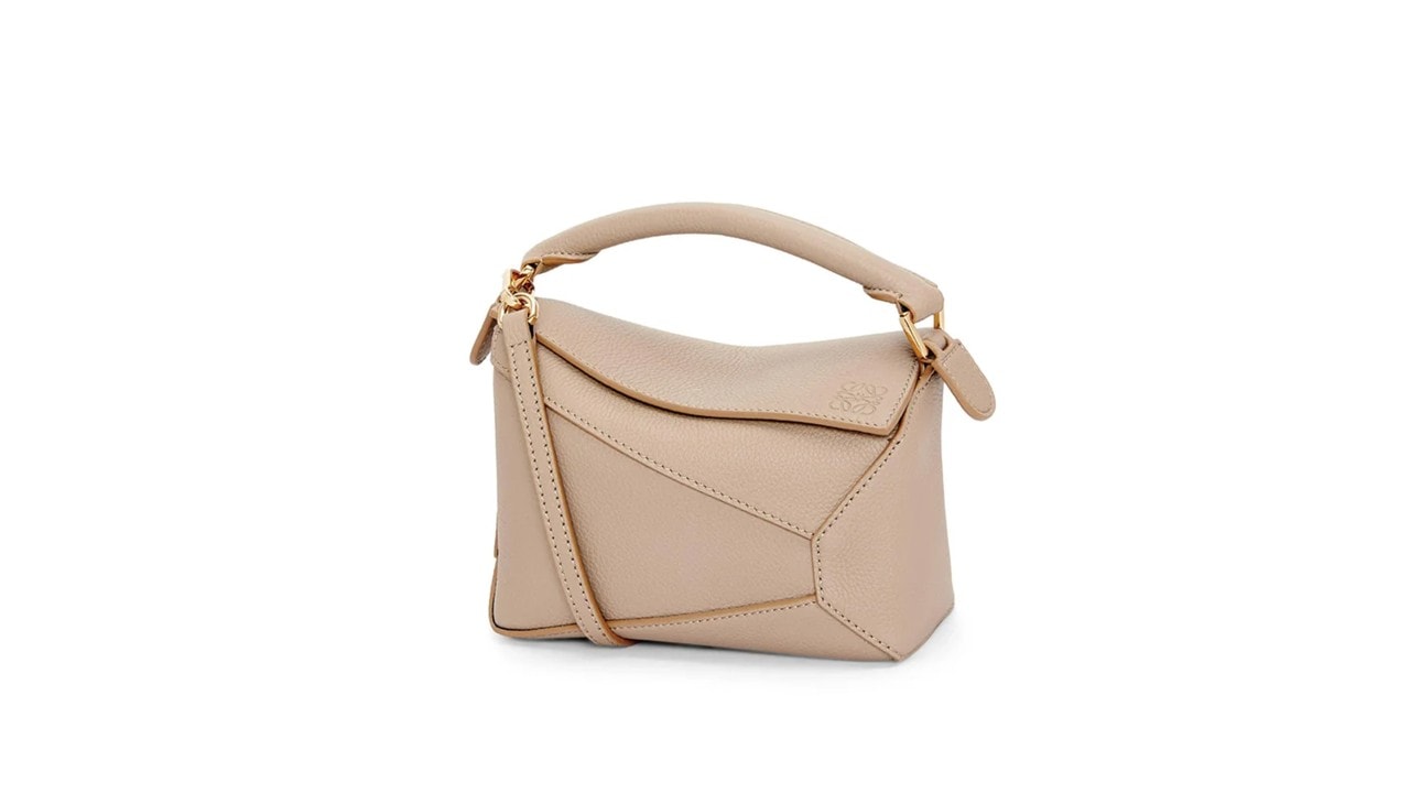 An edgy, puzzle bag in beige from a luxury bag brand, LOEWE