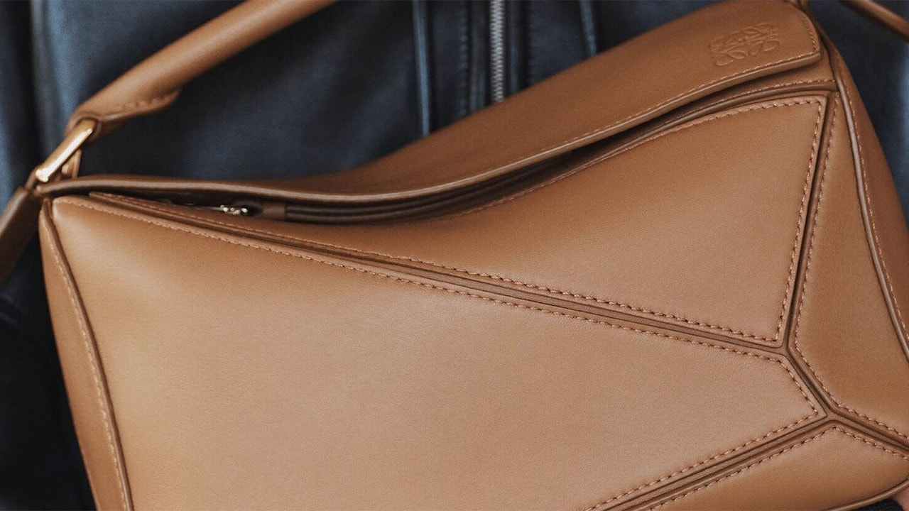 An edgy, puzzle bag in beige from a luxury bag brand, LOEWE
