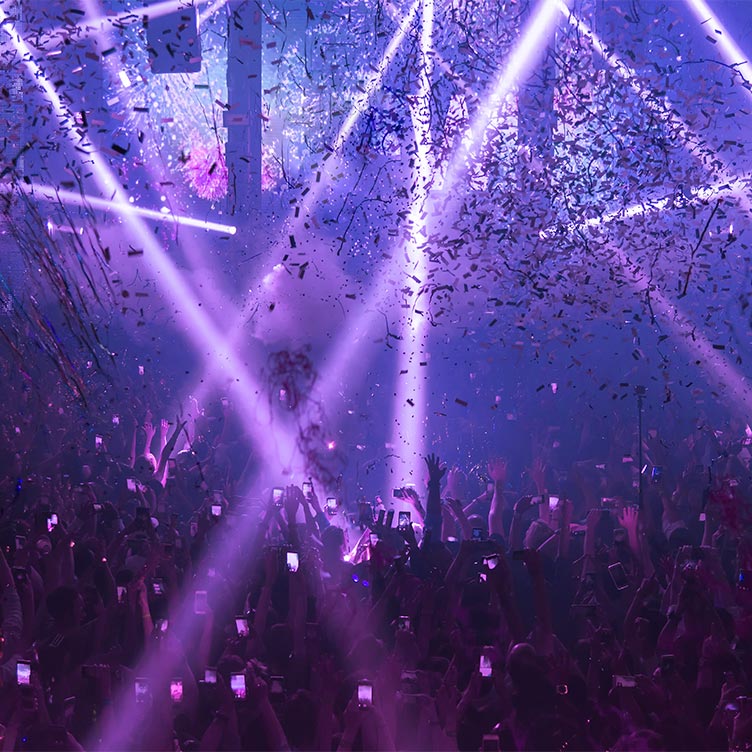 A crowd partying in a nightclub with theme parties held weekly