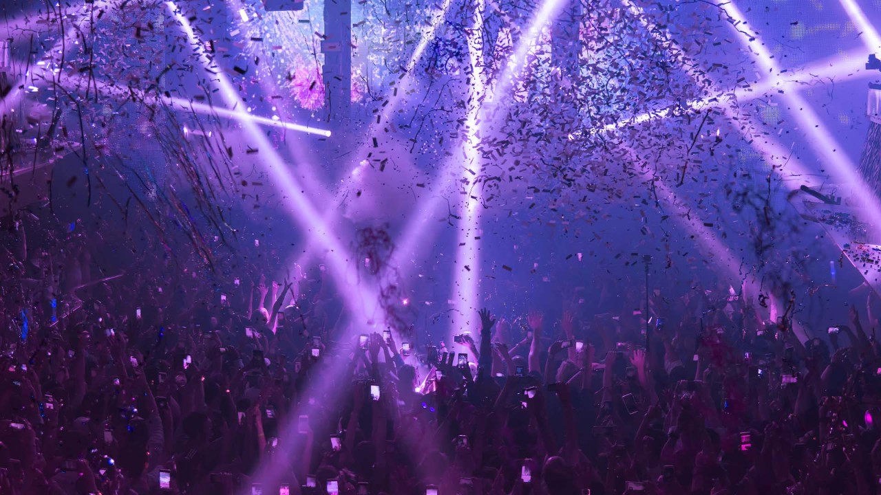 A crowd partying in a nightclub with theme parties held weekly