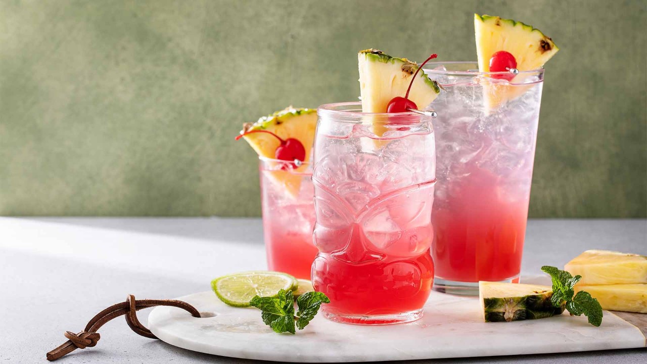 A glass of Singapore Sling, a crimson red cocktail