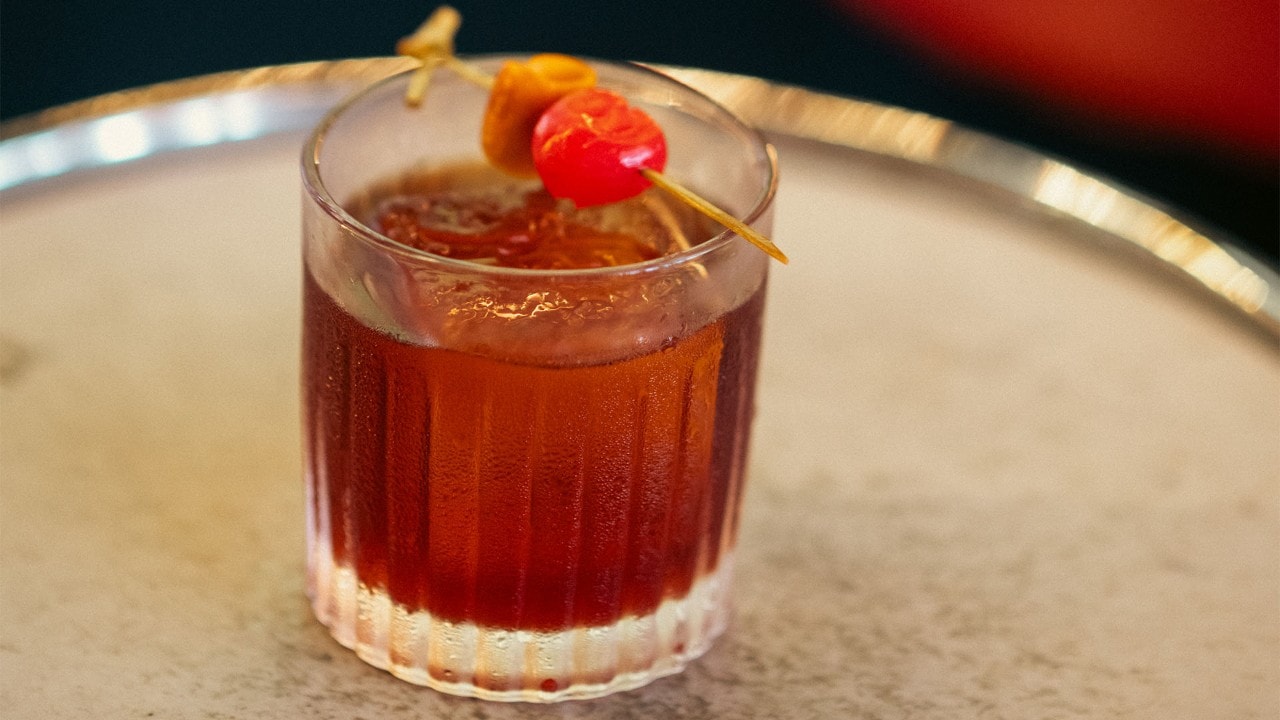 2 cocktails with lychee and orange peel, served at the best bars in Singapore