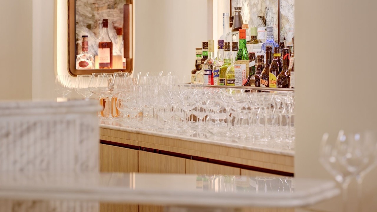 Bar area with wine glasses and bottles of whiskeys at a wine restaurant in Singapore