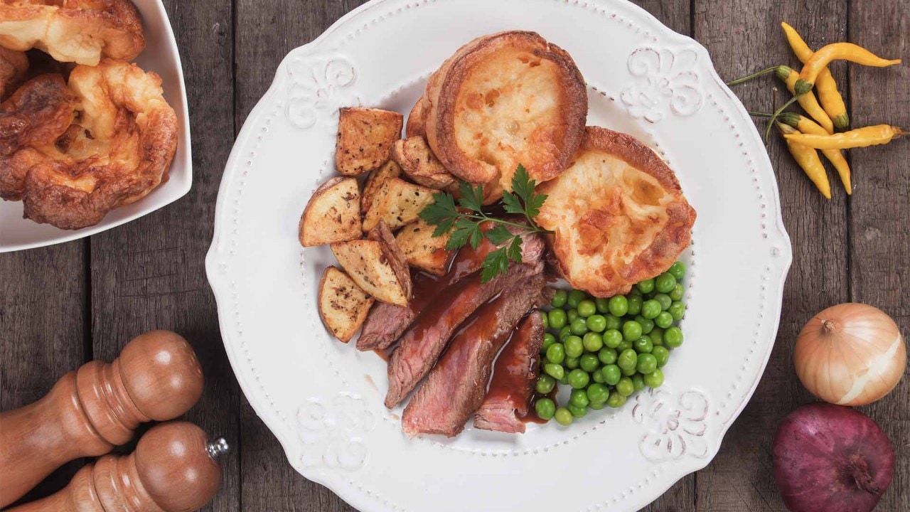 Roast meat, green peas, Yorkshire pudding and potato served at the best Sunday roast places in Singapore