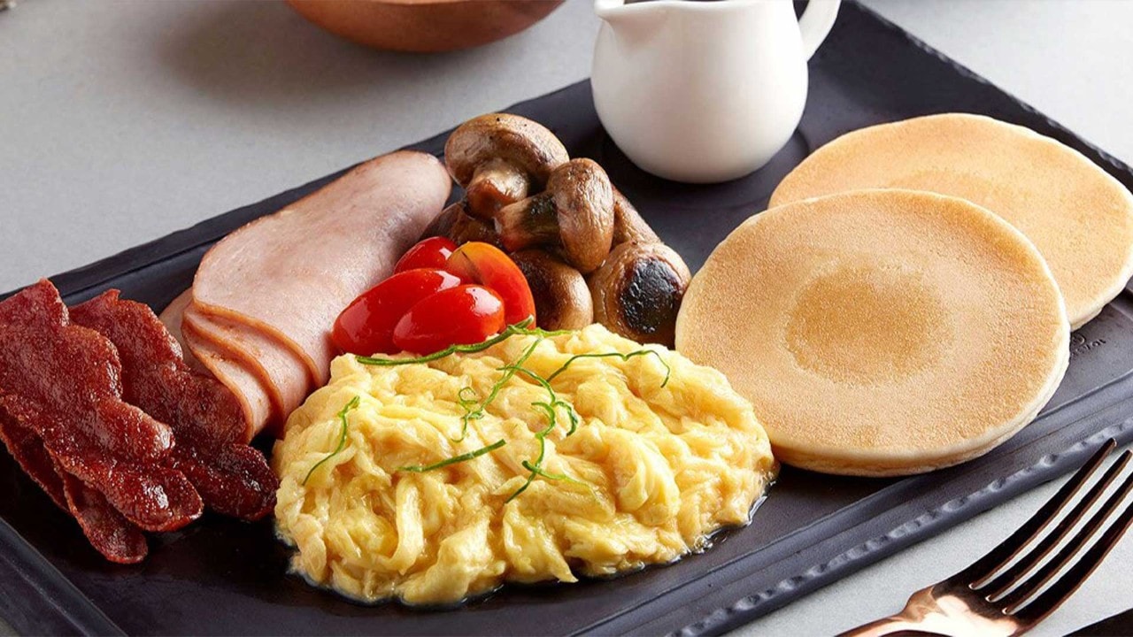 Pancake, scrambled eggs and bacon at the best breakfast restaurants in Singapore