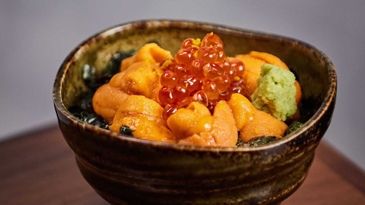 Signature dish from Waku Ghin, topped with fresh sea urchin