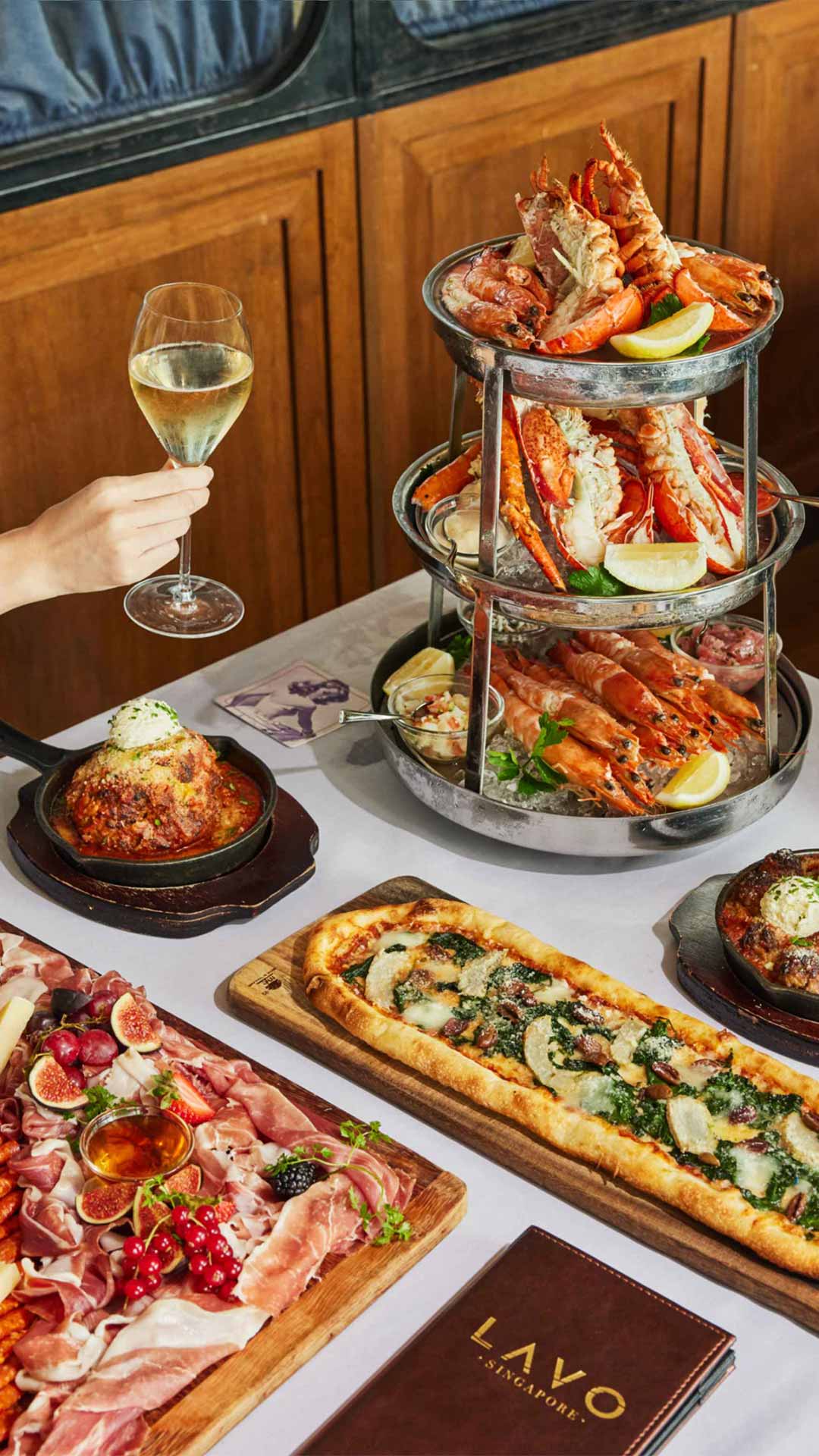 Champagne, pizza and a seafood platter at LAVO, the best dinner place in Singapore