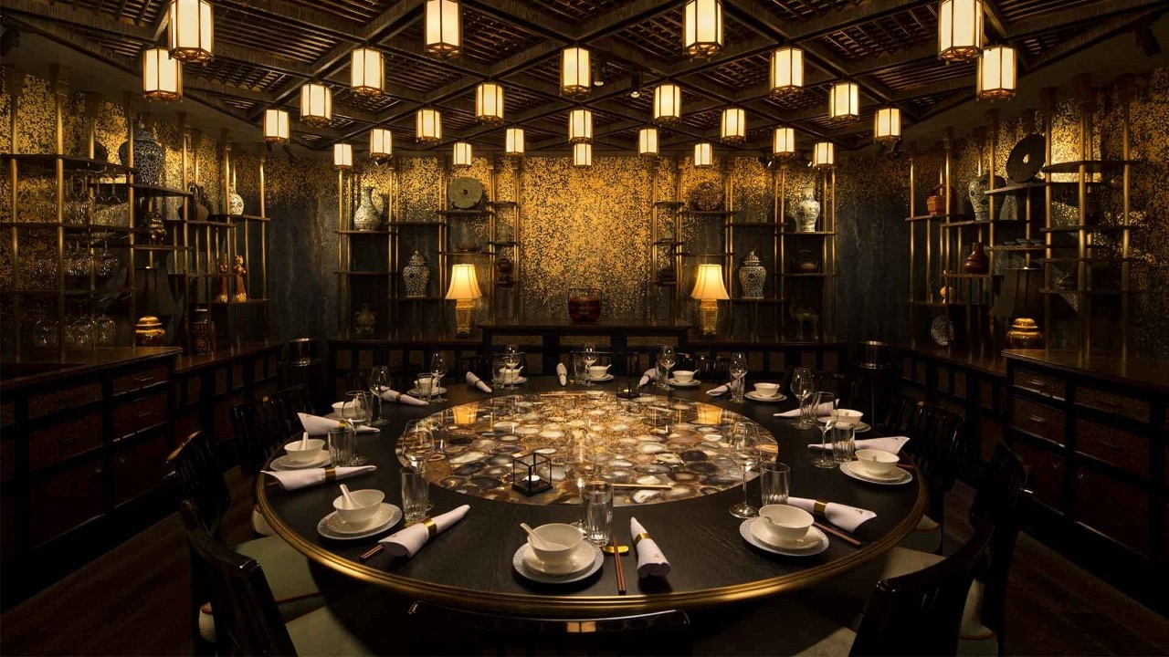 An instagrammable fine dining space with fine cutleries and wine glass lined up at Mott 32 Singapore, Marina Bay Sands