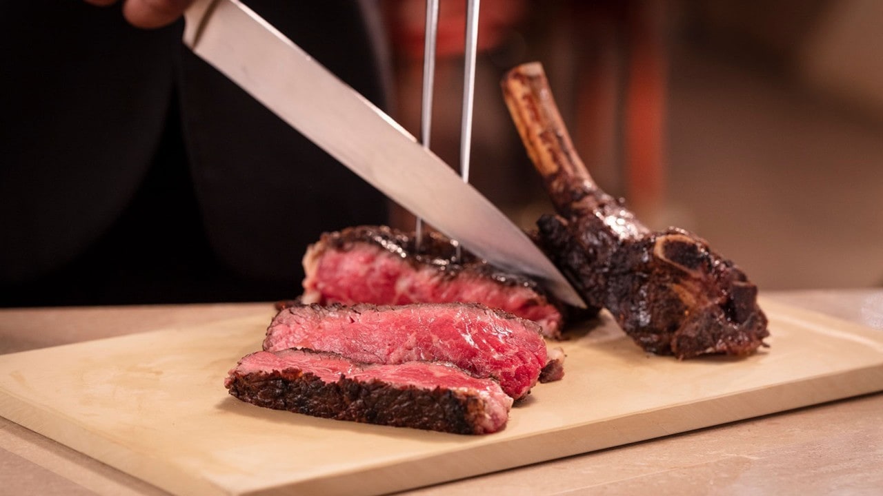 Chef slicing a steak from CUT at Marina Bay Sands, a perfect place for Mother's Day dinner