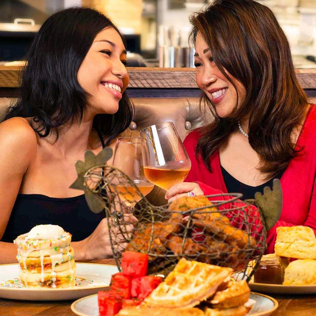 Mother and daughter celebrating Mother's Day with a meal at Yardbird, Singapore