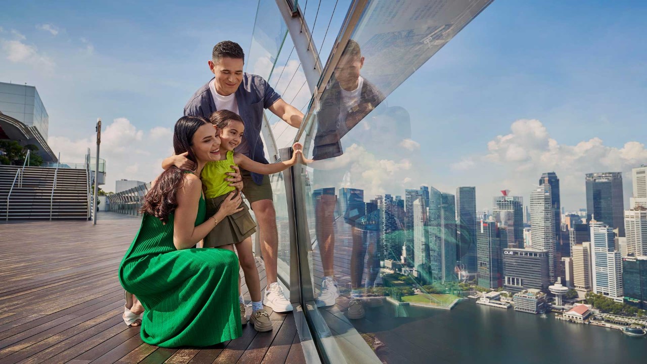 Family looking down from the SkyPark Observation Deck for a Mother's Day activity