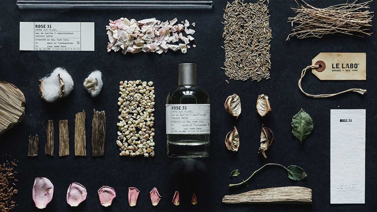 Dried rose petals with a bottle of 'Rose 31' perfume from Le Labo to gift mum this Mother's Day