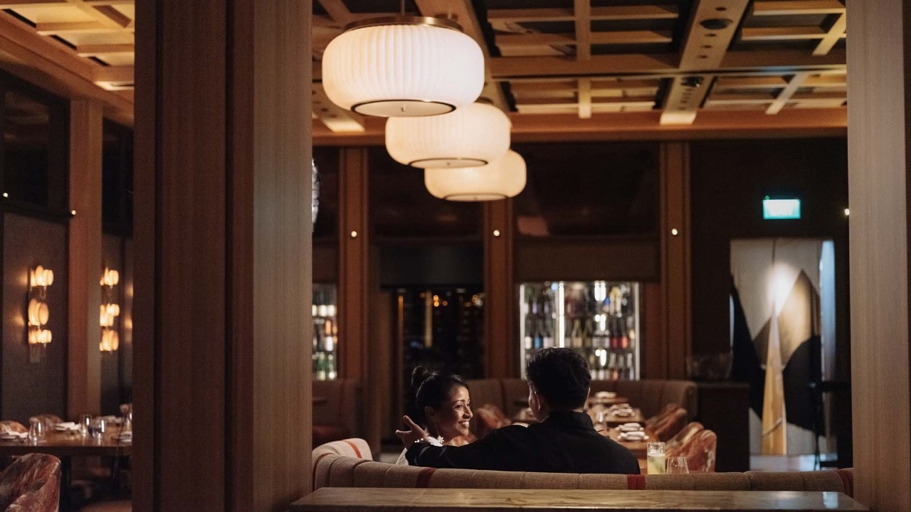 Couple walking along The Shoppes to pick a gift during Valentine's Day