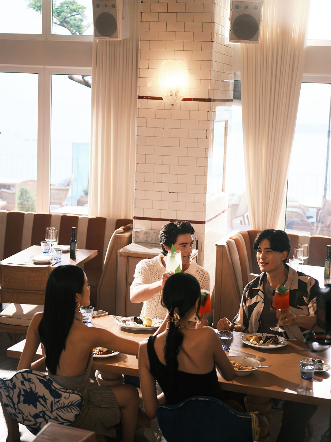 Friends walking down the Helix Bridge to Marina Bay Sands