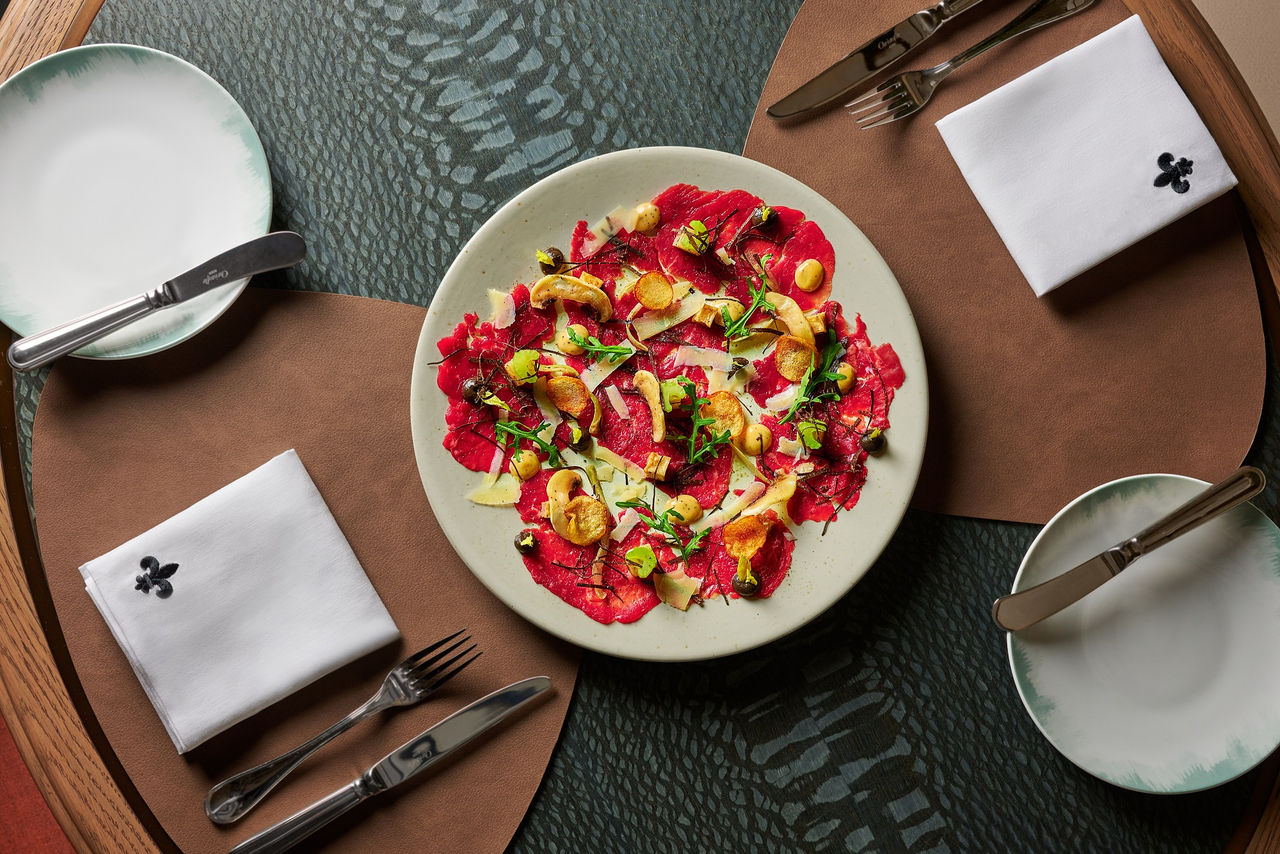 Maison Boulud_Beef filet carpaccio with black truffle dressing.jpg