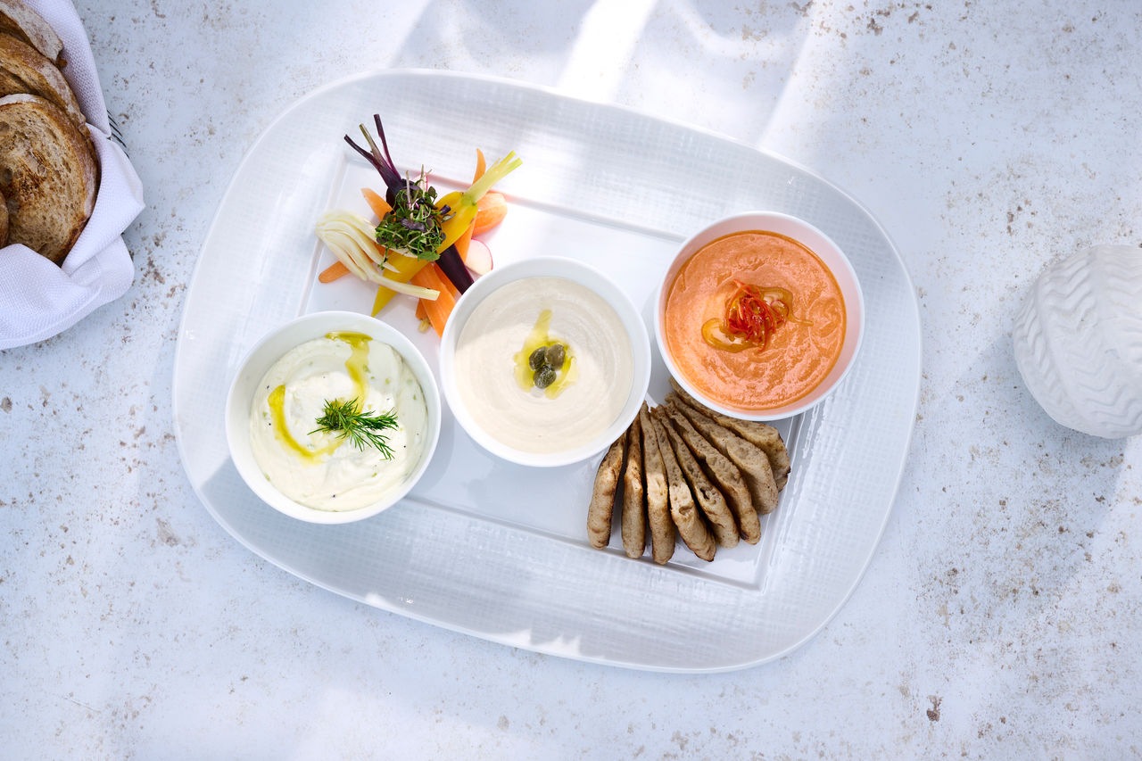 The Greek Spreads includes taramosalata, tzatziki, htipiti and grilled pita.jpg