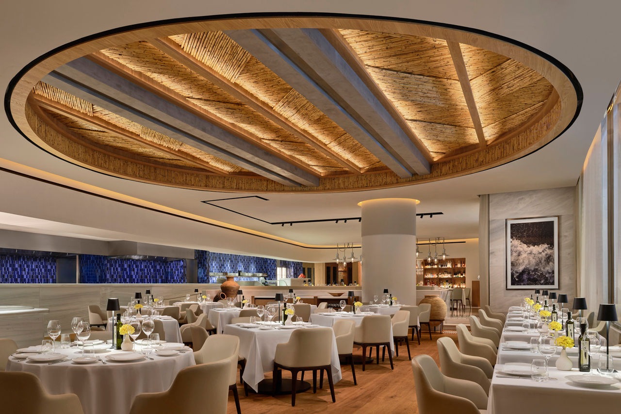 The Kalami ceiling evokes the feeling of dining underneath a pergola at a coastal.jpg
